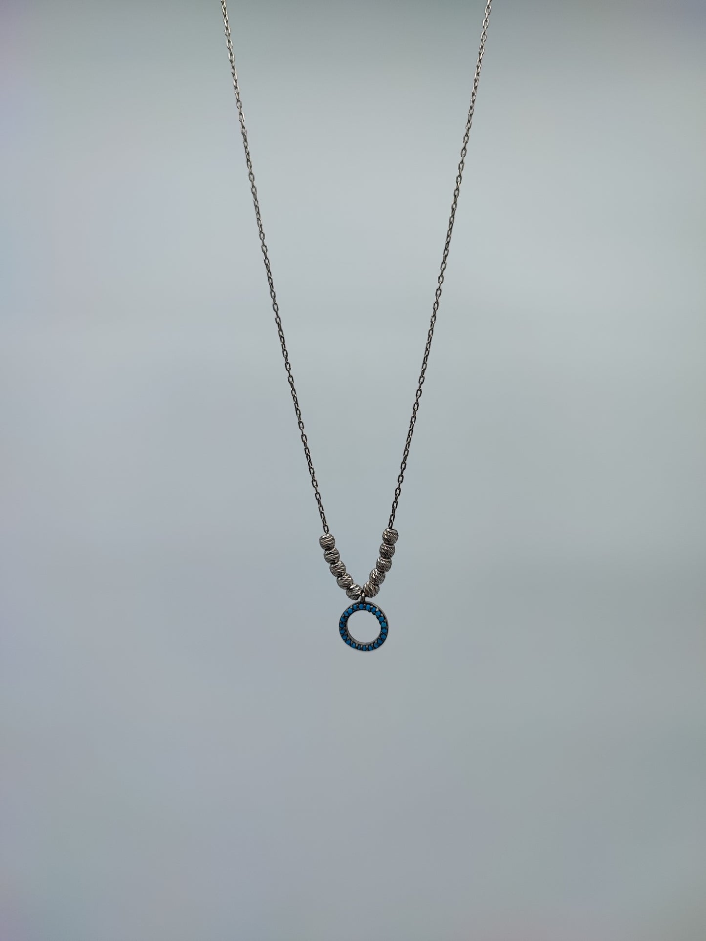 Collar plata con dije circulo azul