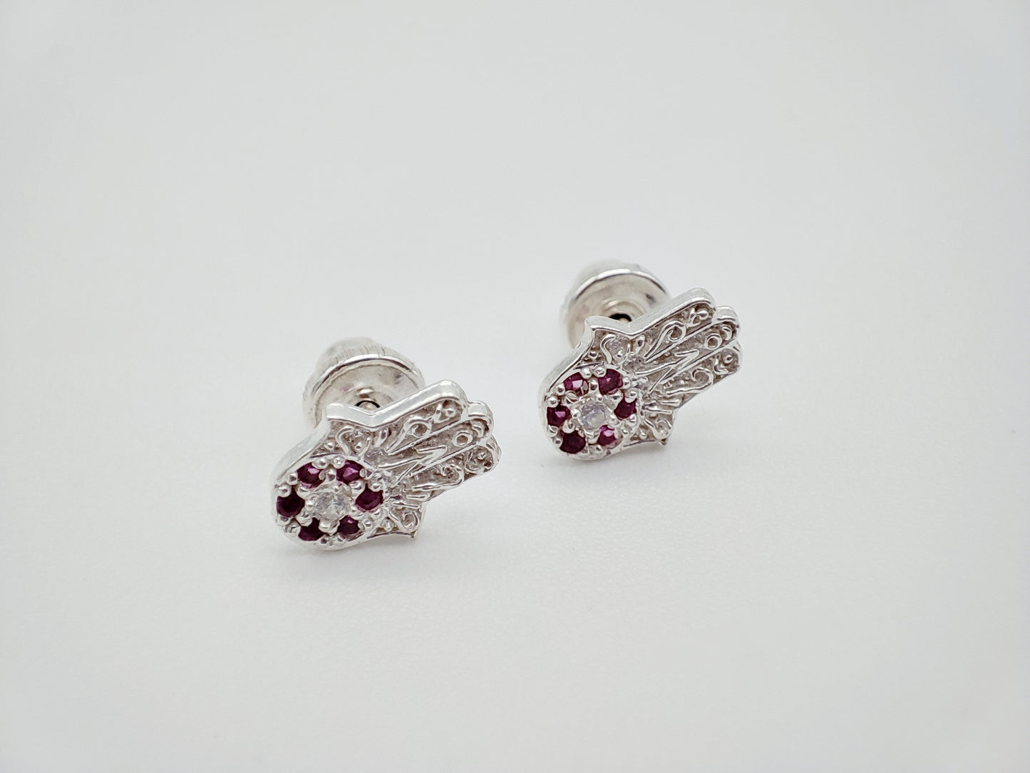 Broqueles manita plata con cristales rosas