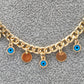 Cadena con dijes circulo y ojos azules