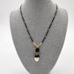 Juego collar y aretes negro con perlas