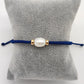 Pulsera azul con perla
